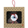 evil eye charm in a craft box