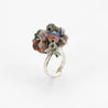 silver ring with blue and orange paper flowers