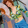 happy young woman holding a fan 