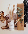 reed diffuser with reindeer wooden decor