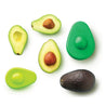 a display of cut and a whole avocados with a dark and a light green avocado hugger used to store cut avocados
