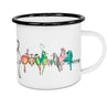 white enamel cup with colorful birds on a wire