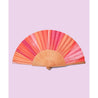 an open fan with orange, darkpink and peachy colors on a lilac background