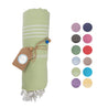 wrapped light green towel with white stripes and beautiful beaded detail next to a color index