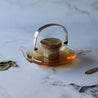 Glass teapot with stainless steel filter and wooden lid