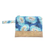 beach handbag with cork detail and big blue annd white flowers on white bachground