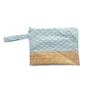 beach handbag with cork detail and blue and brown geometrical patterned fabric on white background