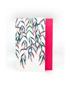 a greeting card with multicolored leaves and a dark pink envelope